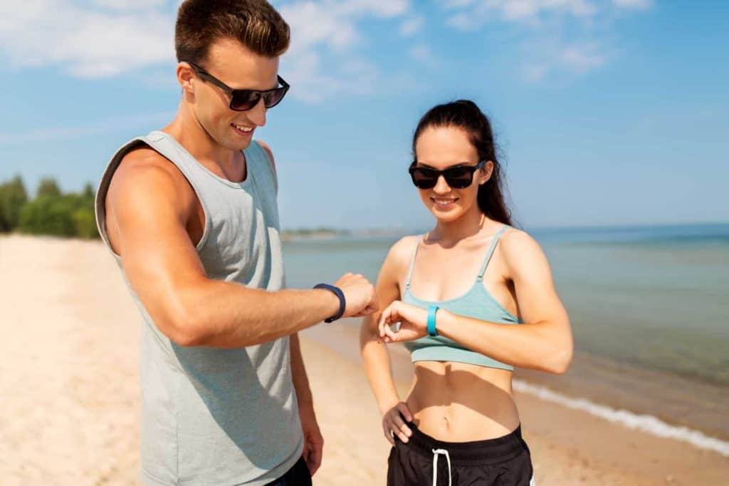 couple check activity trackers