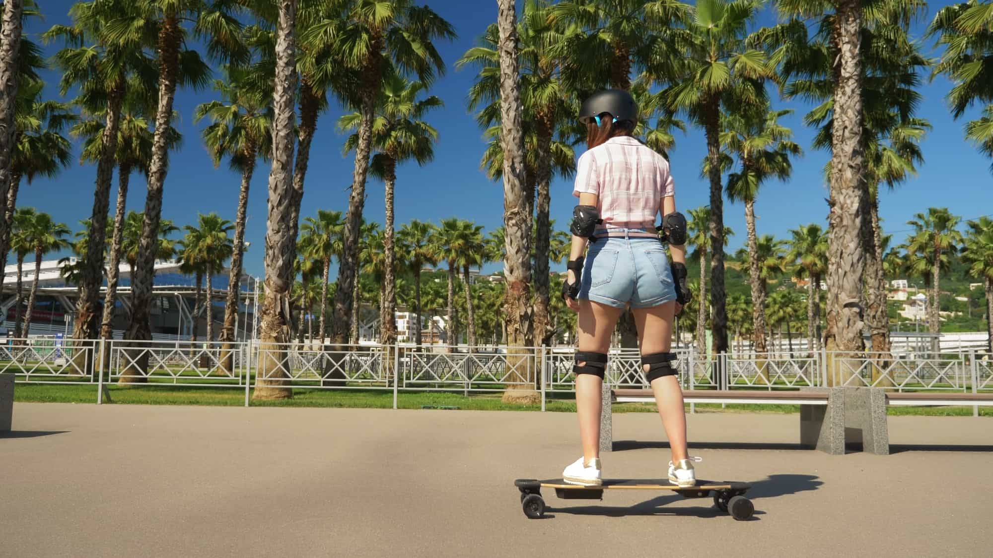 girl riding an electric skateboard