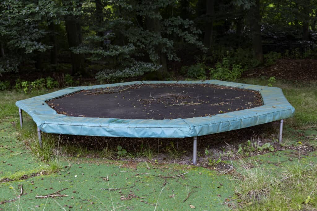 unmaintained trampoline for outdoor activities